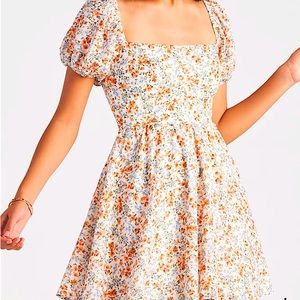 A Windsor dress with a open back a dress above the knees